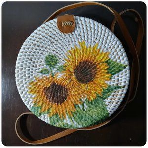 HAND-WOVEN RATTAN, ROUND CROSS-BODY BAG with SUNFLOWERS by COLLECTION EIGHTEEN